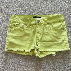 Neon yellow denim shorts